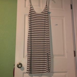 black & white striped dress with slit on left leg